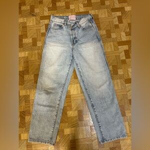 REVICE Classic Straight Leg Light Blue Jeans with Asymmetrical Waistband.